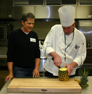 OWMC owner Jeff Matthews at a demonstration with Phil Anderson, Executive Chef at Harris Teeter